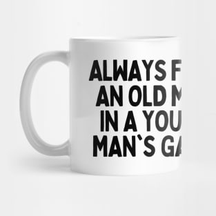 Never underestimate an old man in a young's man game Mug